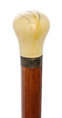 An English Ivory Handled Walking Stick, Length of handle 2 1/8 x length overall 45 1/4 inches.