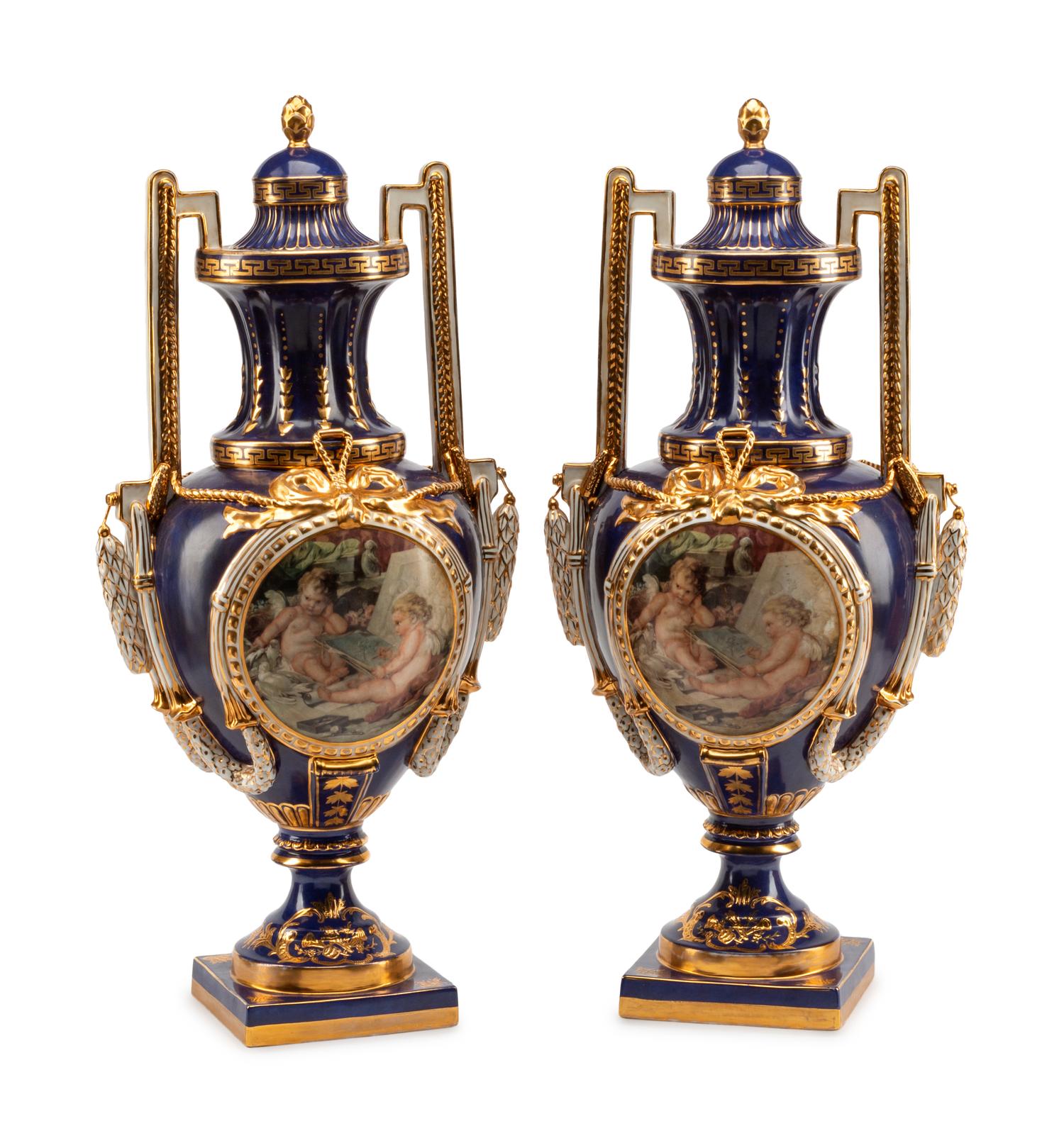 A Pair of Sèvres Style Porcelain Urns