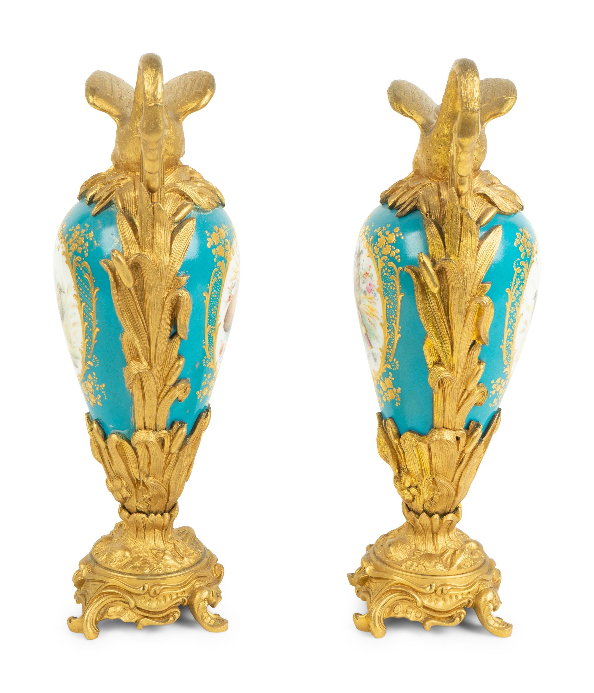 A Pair of Gilt Bronze Mounted Sevres Style Porcelain Ewers — 19TH CENTURY