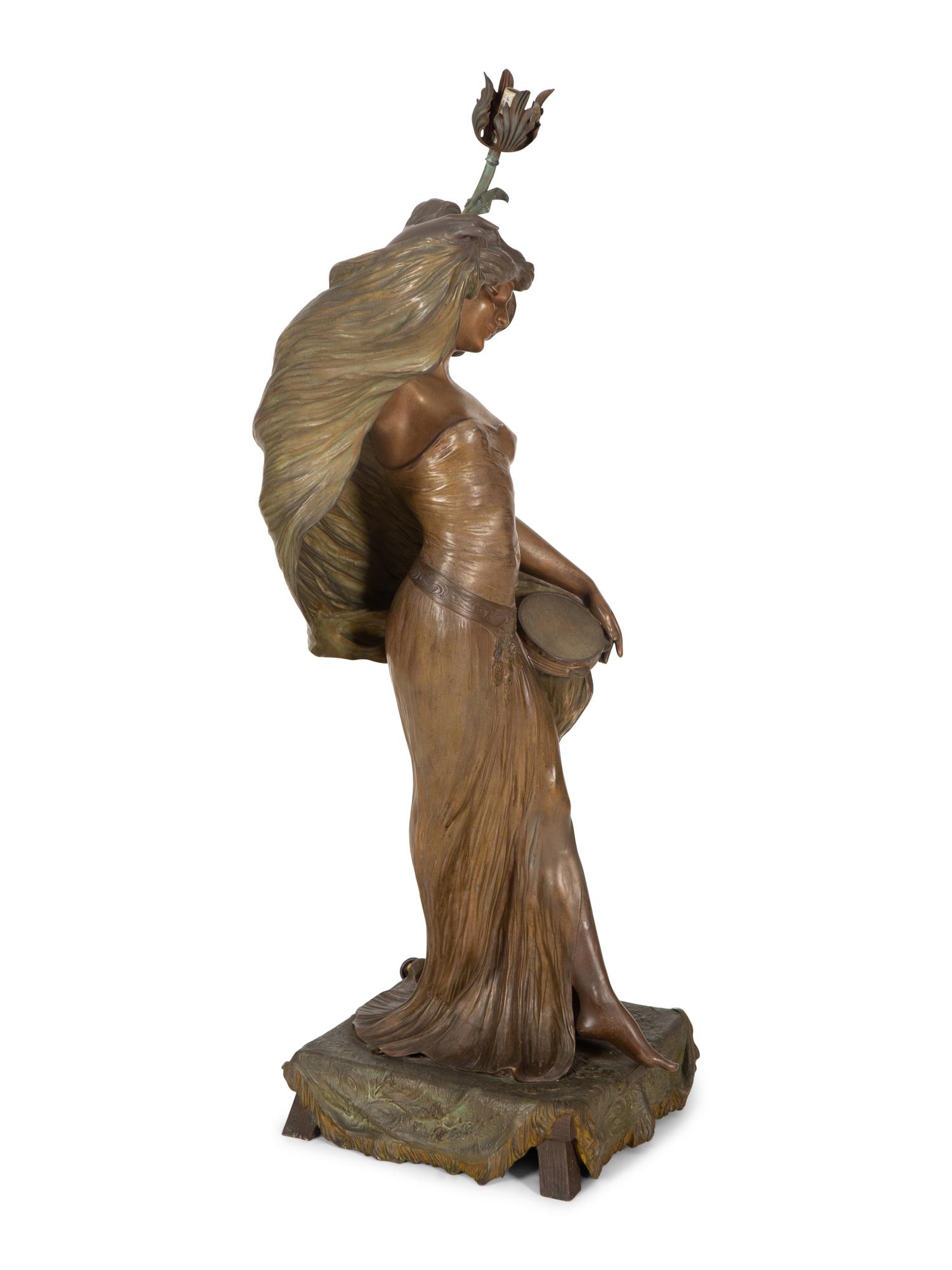 A Patinated Metal Figure of a Standing Maiden Mounted as a Lamp