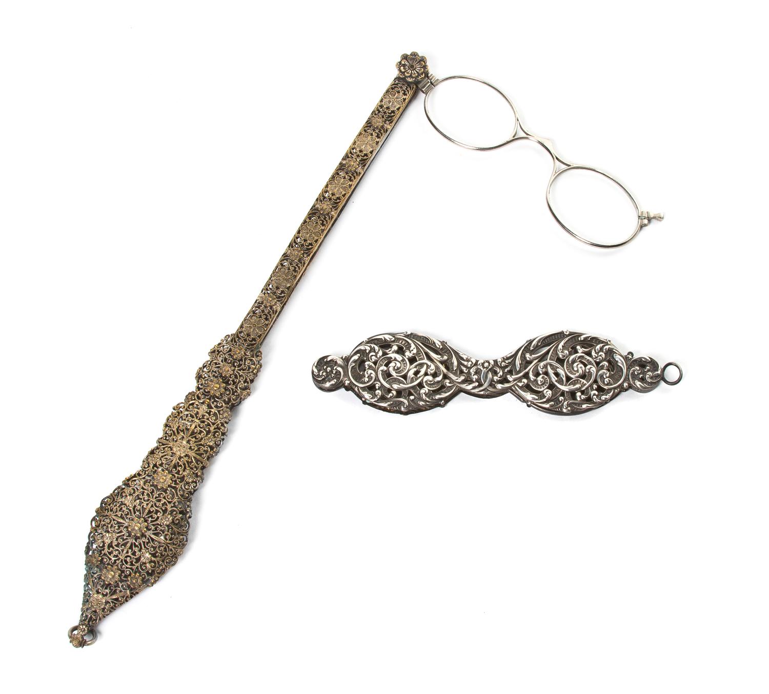Two Silvered Metal Mounted Lorgnettes, Length of first 9 3/4 inches.