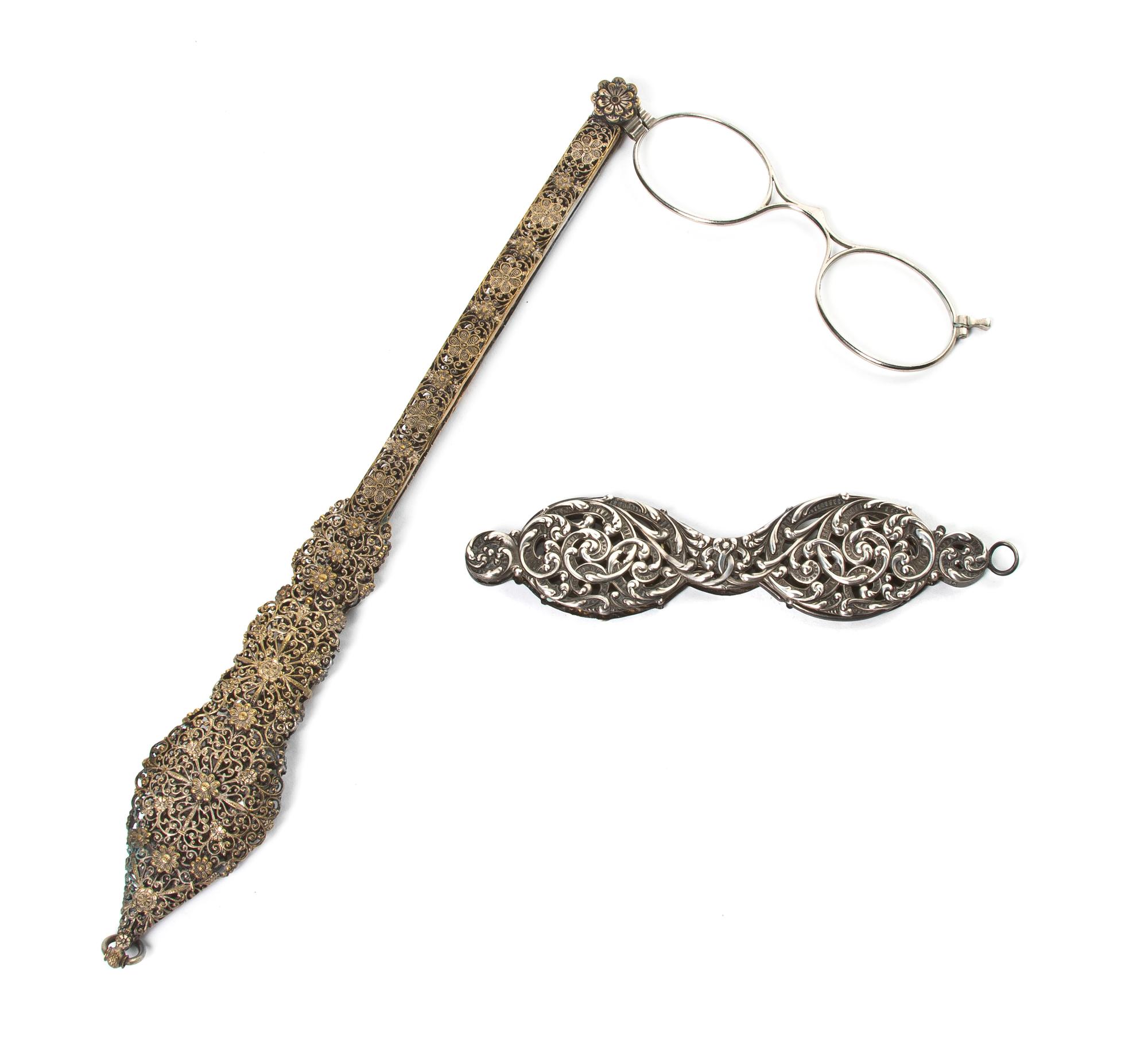 Two Silvered Metal Mounted Lorgnettes, Length of first 9 3/4 inches.