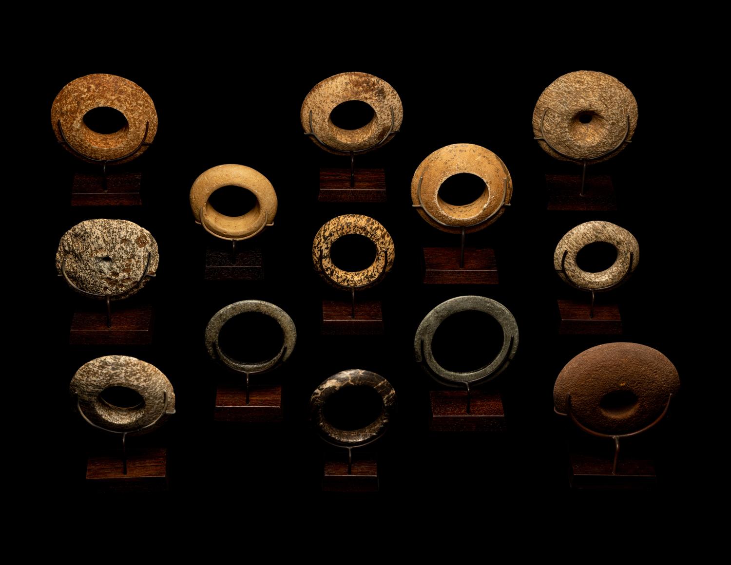 Thirteen Saharan Stone Bracelets and Discoidals