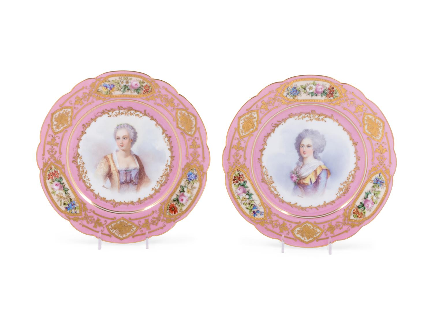 A Pair of Sèvres Painted and Parcel Gilt Pink-Ground Porcelain Plates