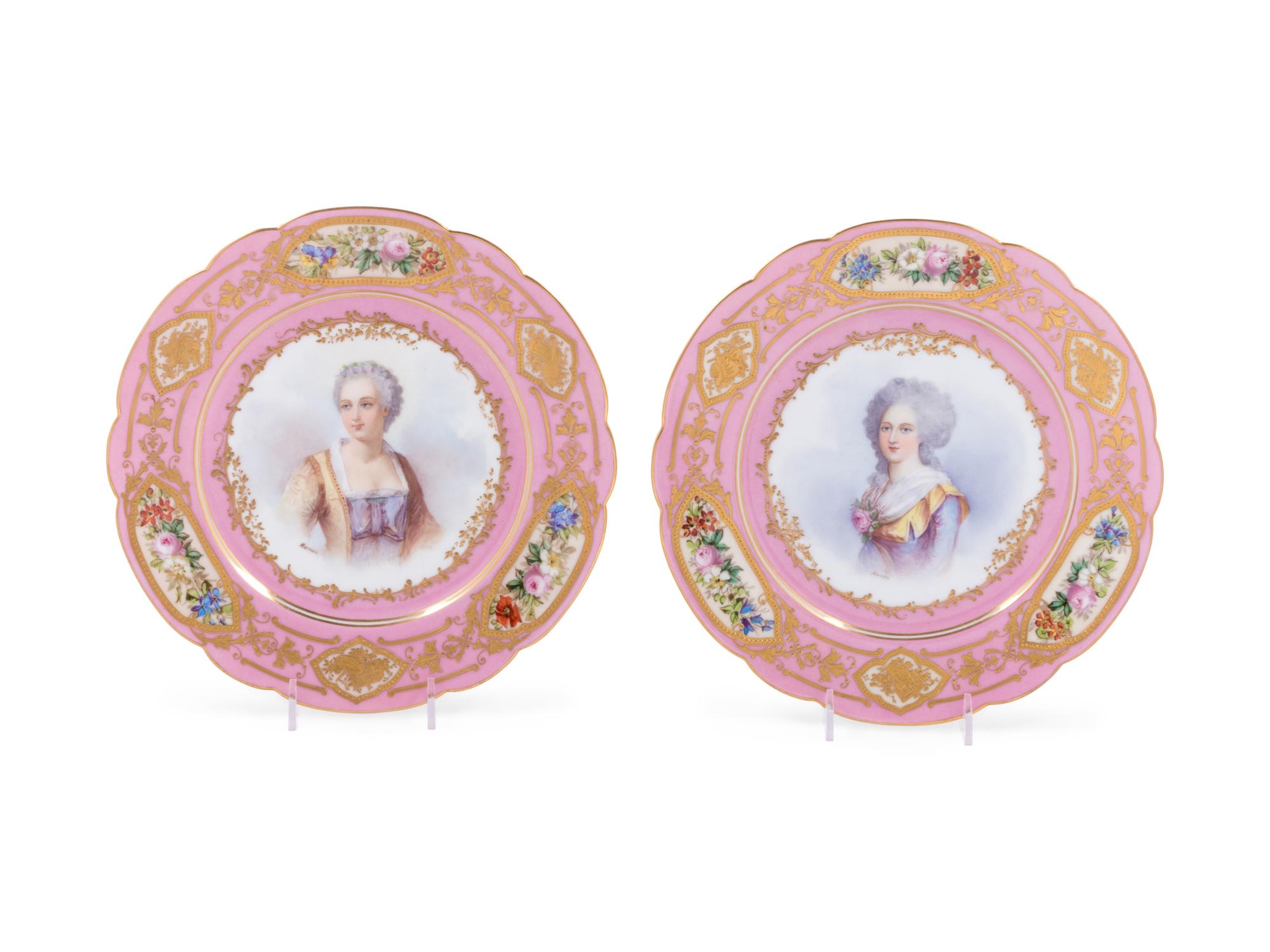 A Pair of Sèvres Painted and Parcel Gilt Pink-Ground Porcelain Plates