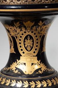 A Pair of Monumental Sèvres Style Gilt Metal Mounted Porcelain Covered Urns on Pedestals