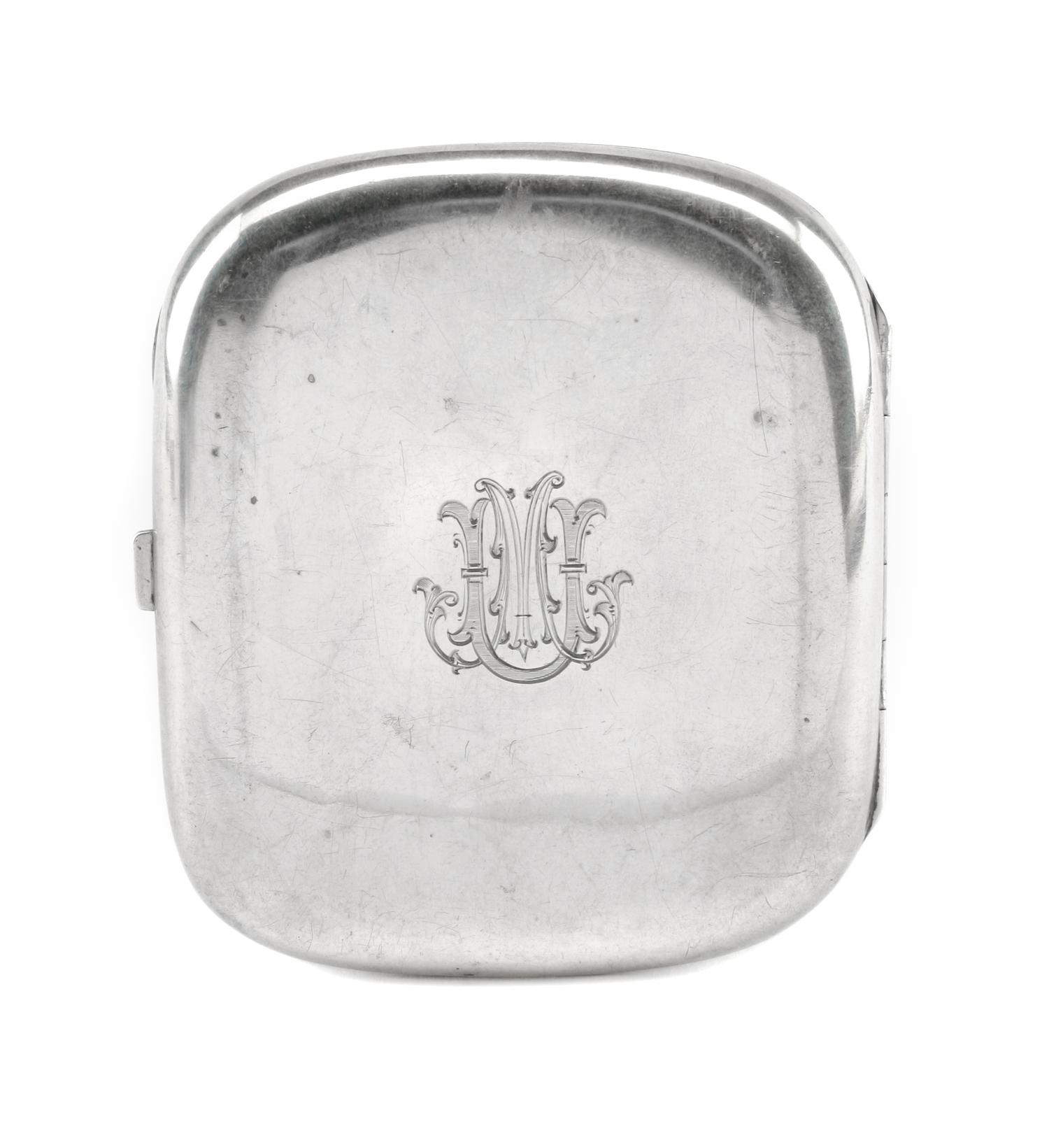 A German Enameled Silver Cigarette Case, Late 19th/Early 20th Century, the lid enameled to show a reclining nude, the underside with an