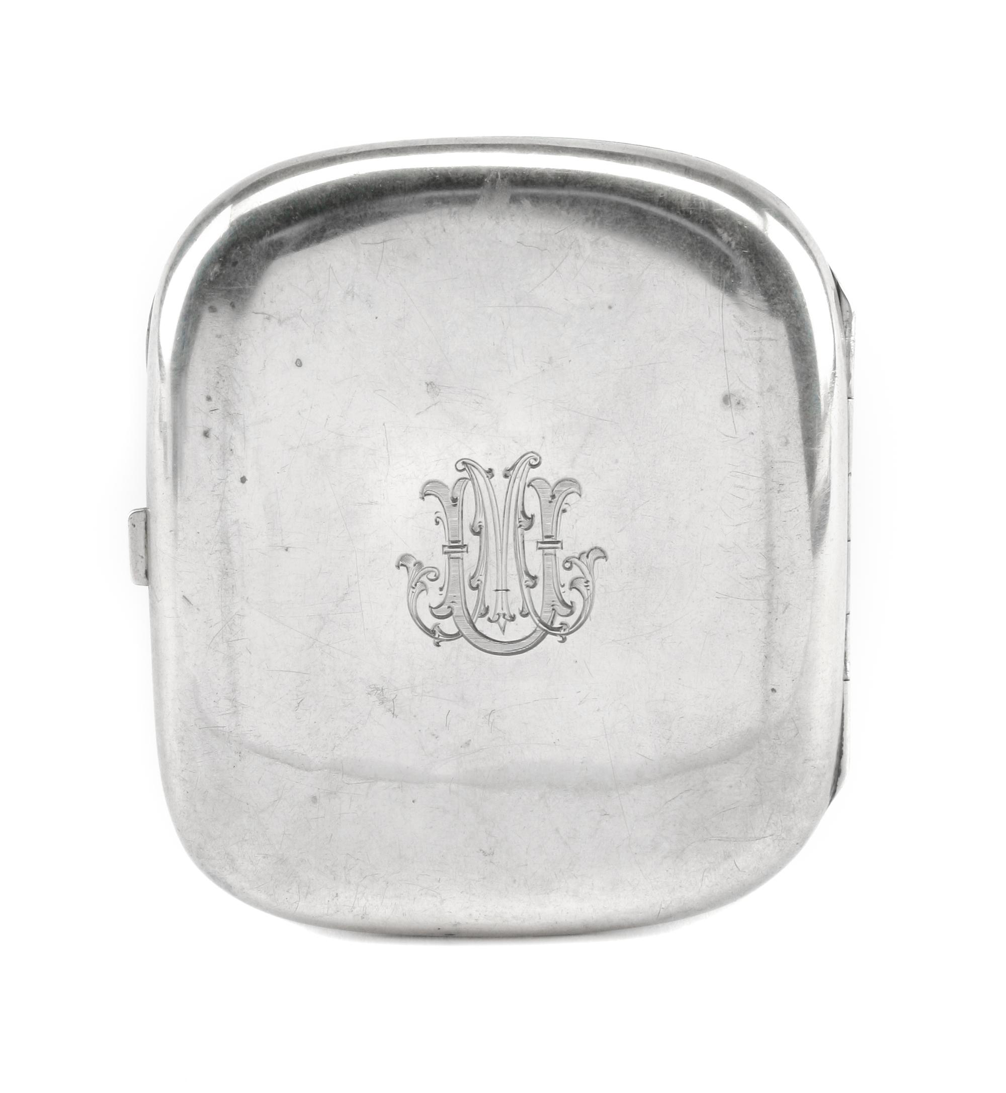 A German Enameled Silver Cigarette Case, Late 19th/Early 20th Century, the lid enameled to show a reclining nude, the underside with an