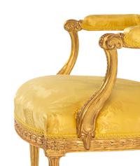 A Pair of George III Carved Giltwood Armchairs