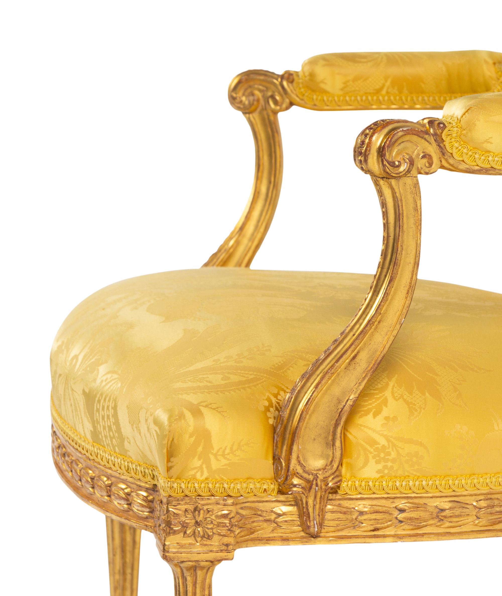 A Pair of George III Carved Giltwood Armchairs