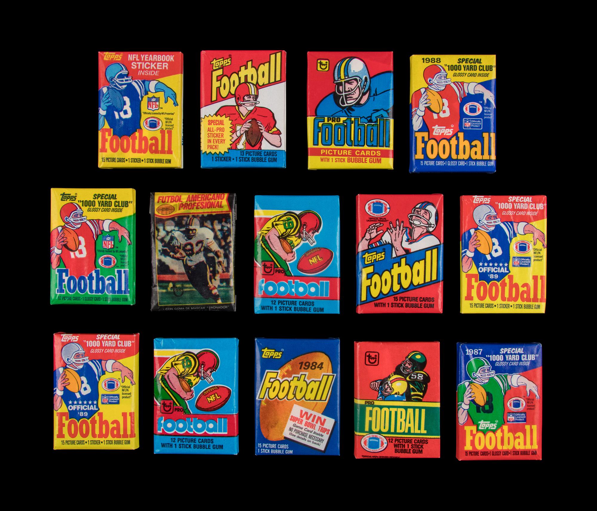 A Large Collection of Unopened and Sealed 1970s and 1980s Topps Football Wax Packs