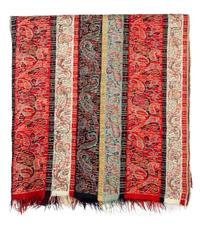 A Group of Pillows and Two Paisley Coverlets Larger paisley 10 feet 11 inches x 5 feet 4 inches.