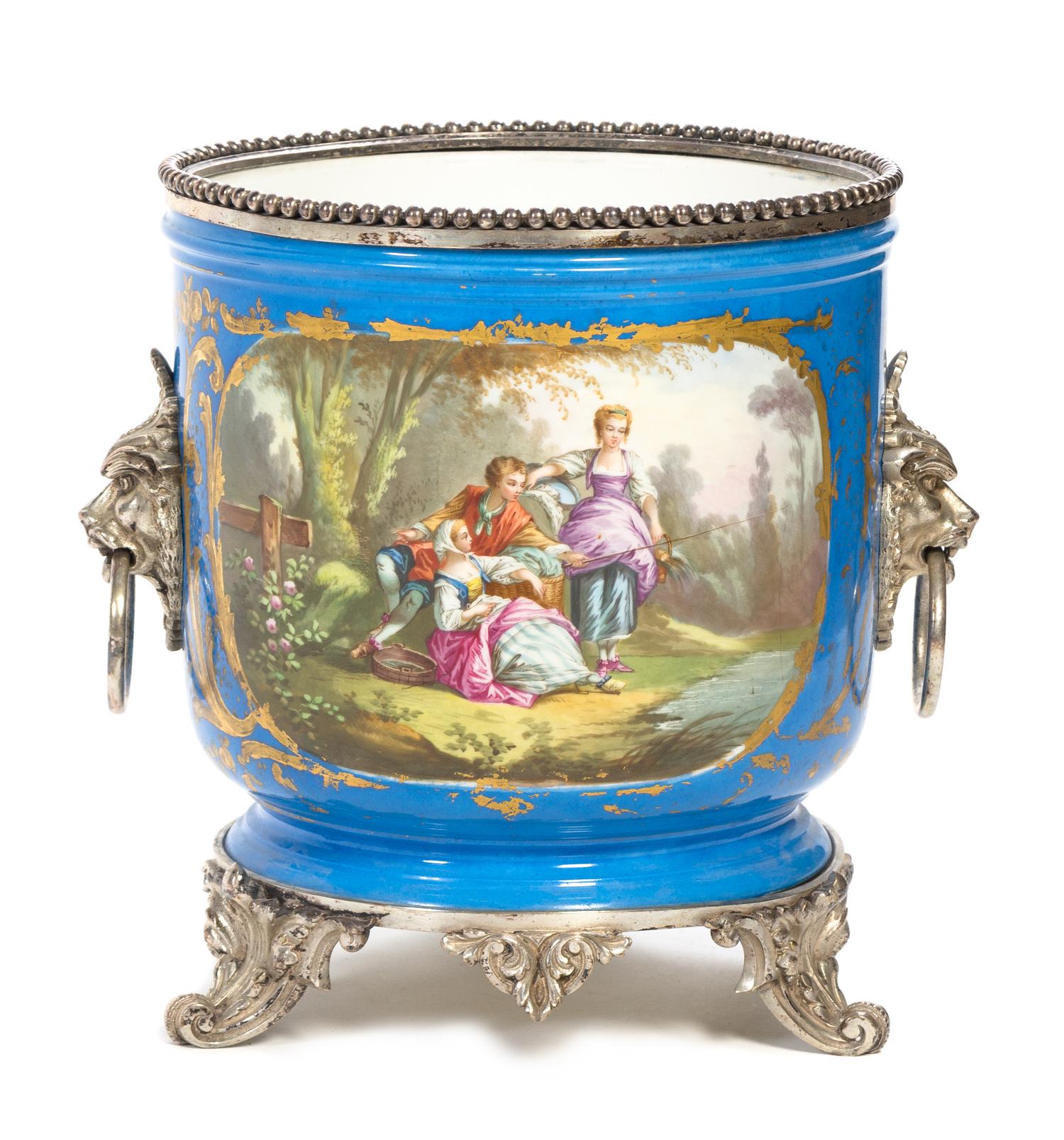 A Silvered Bronze Mounted Sevres Style Porcelain Jardiniere Height 12 x diameter 10 1/2 inches.