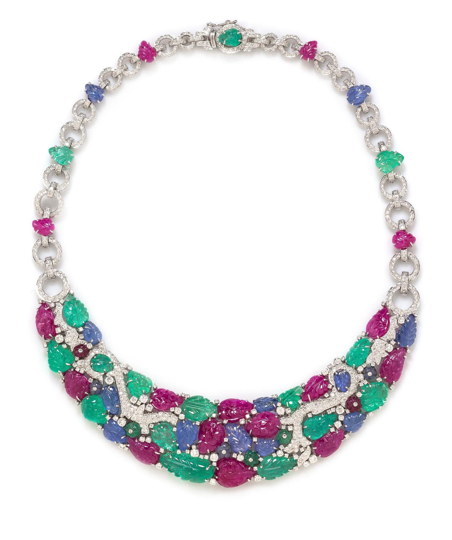An 18 Karat White Gold, Diamond, Carved Ruby, Sapphire, and Emerald Necklace, 58.70 dwts.