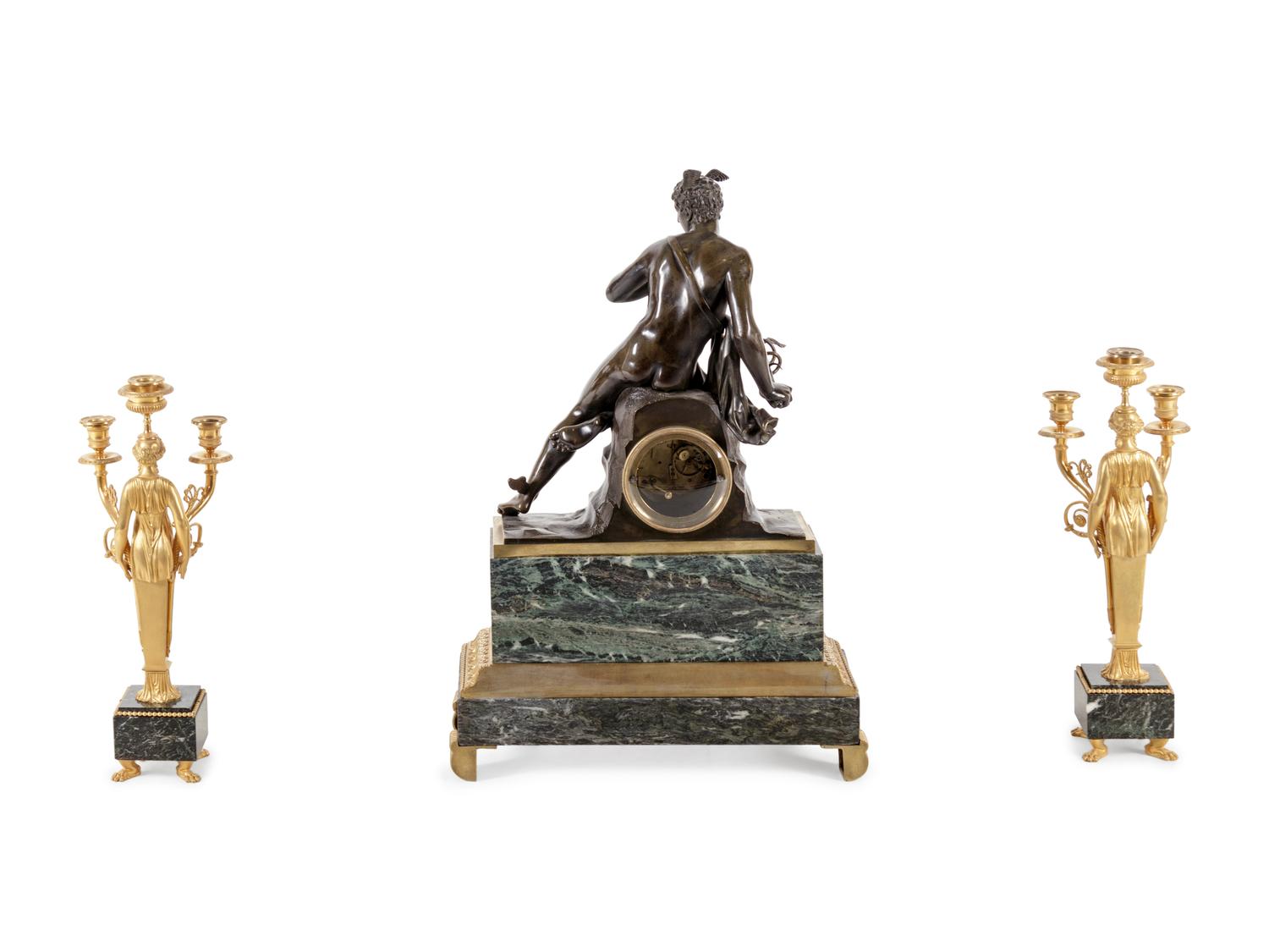 An Empire Style Gilt and Patinated Bronze and Marble Clock Garniture