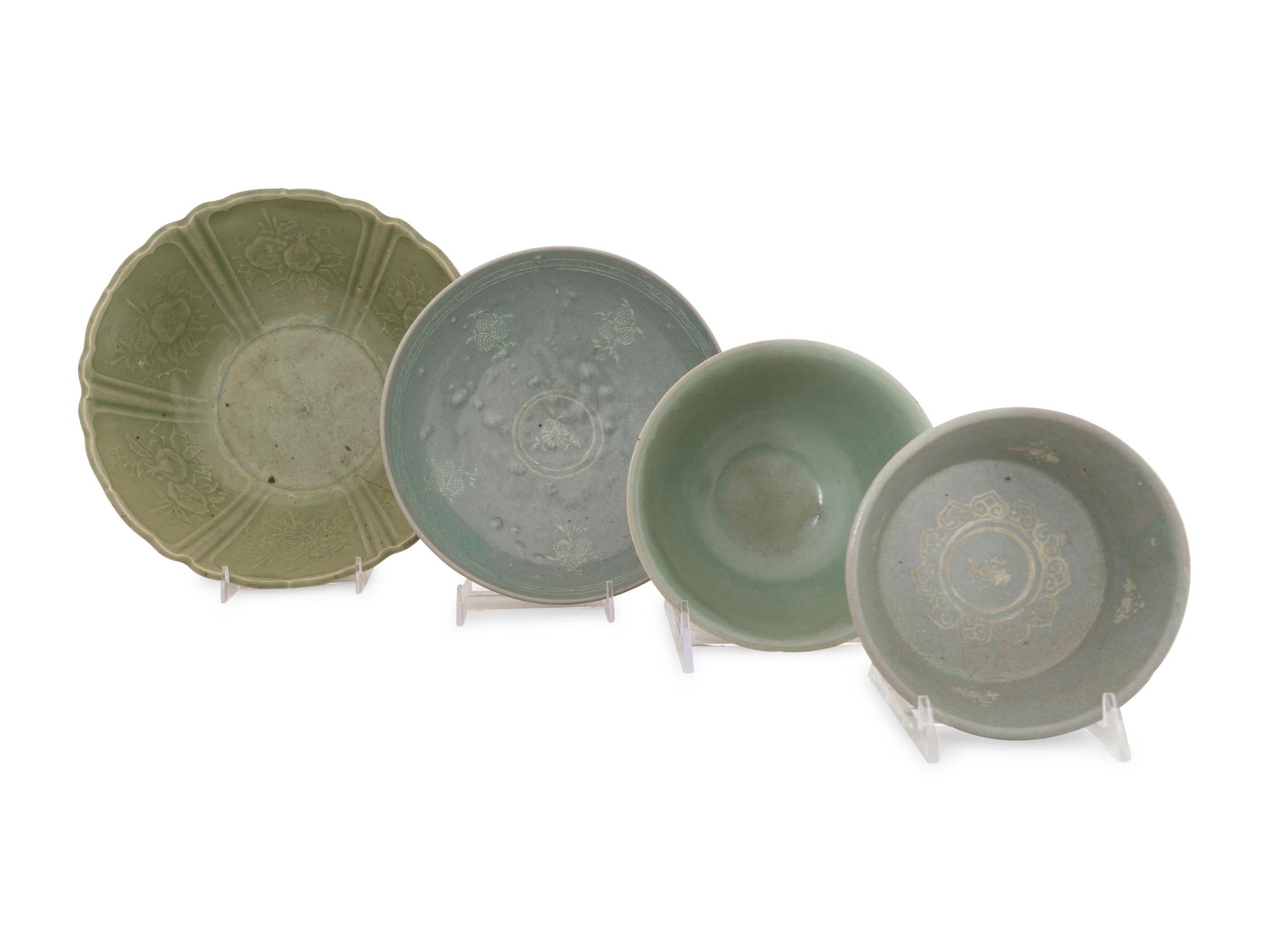 A Collection of Four Chinese and Korean Celadon Porcelain Bowls