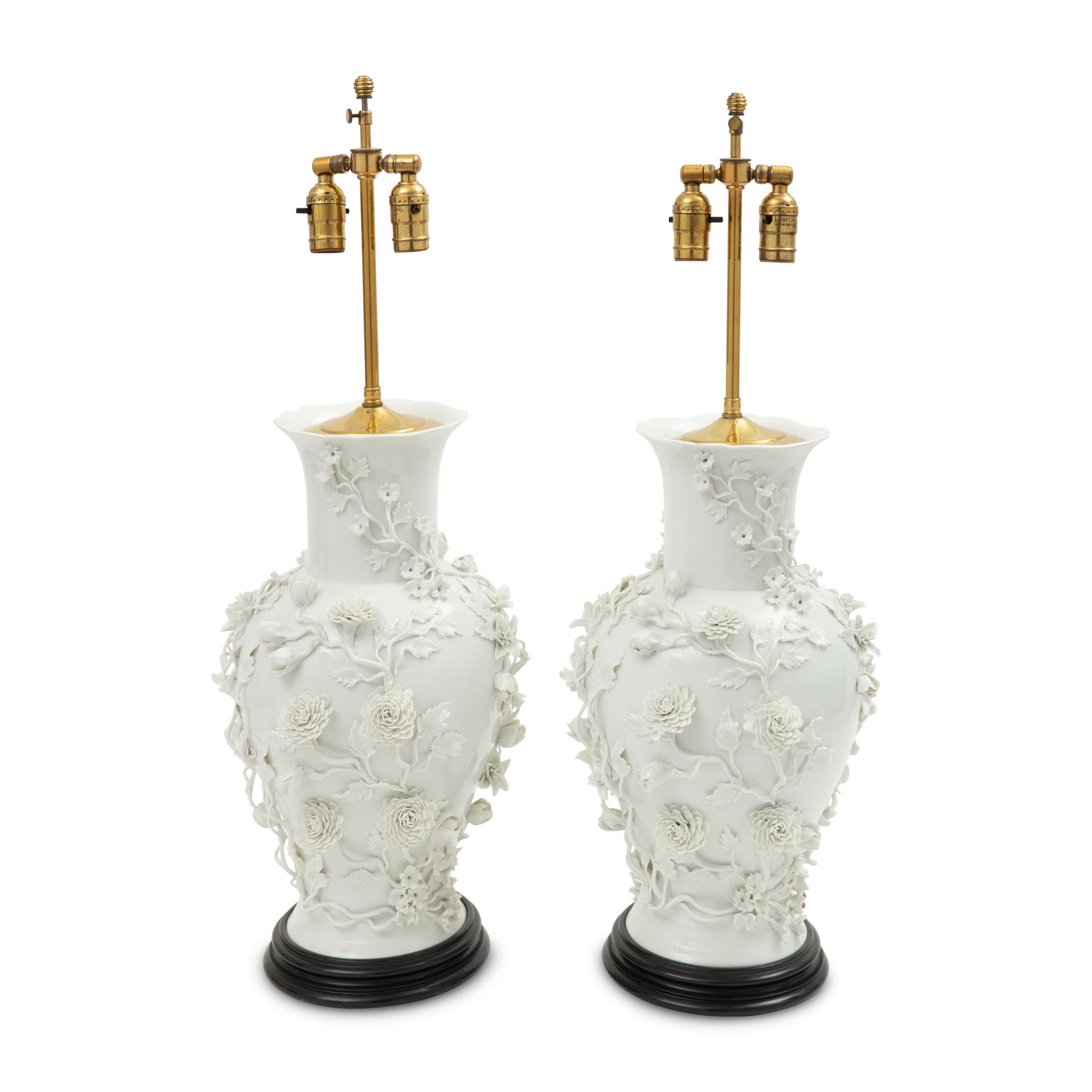 A Pair of Blanc de Chine Floral Porcelain Vases Mounted as Lamps