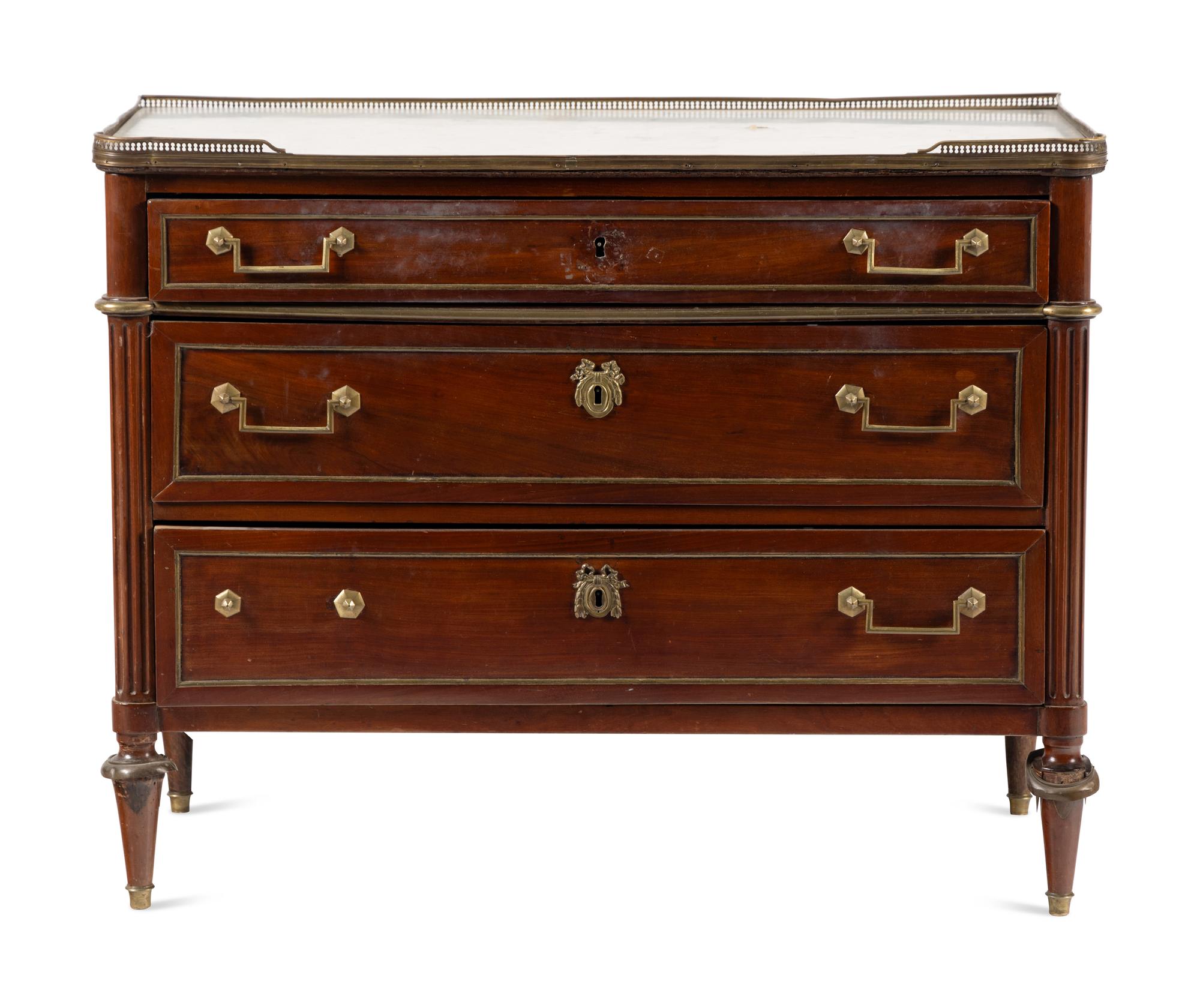 A Directoire Gilt Bronze Mounted Mahogany and Marble-Top Commode
