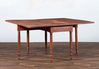 A Late Federal Cherrywood Drop-Leaf Dining Table