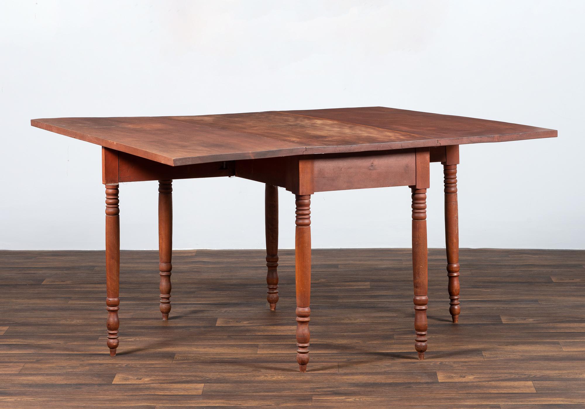 A Late Federal Cherrywood Drop-Leaf Dining Table