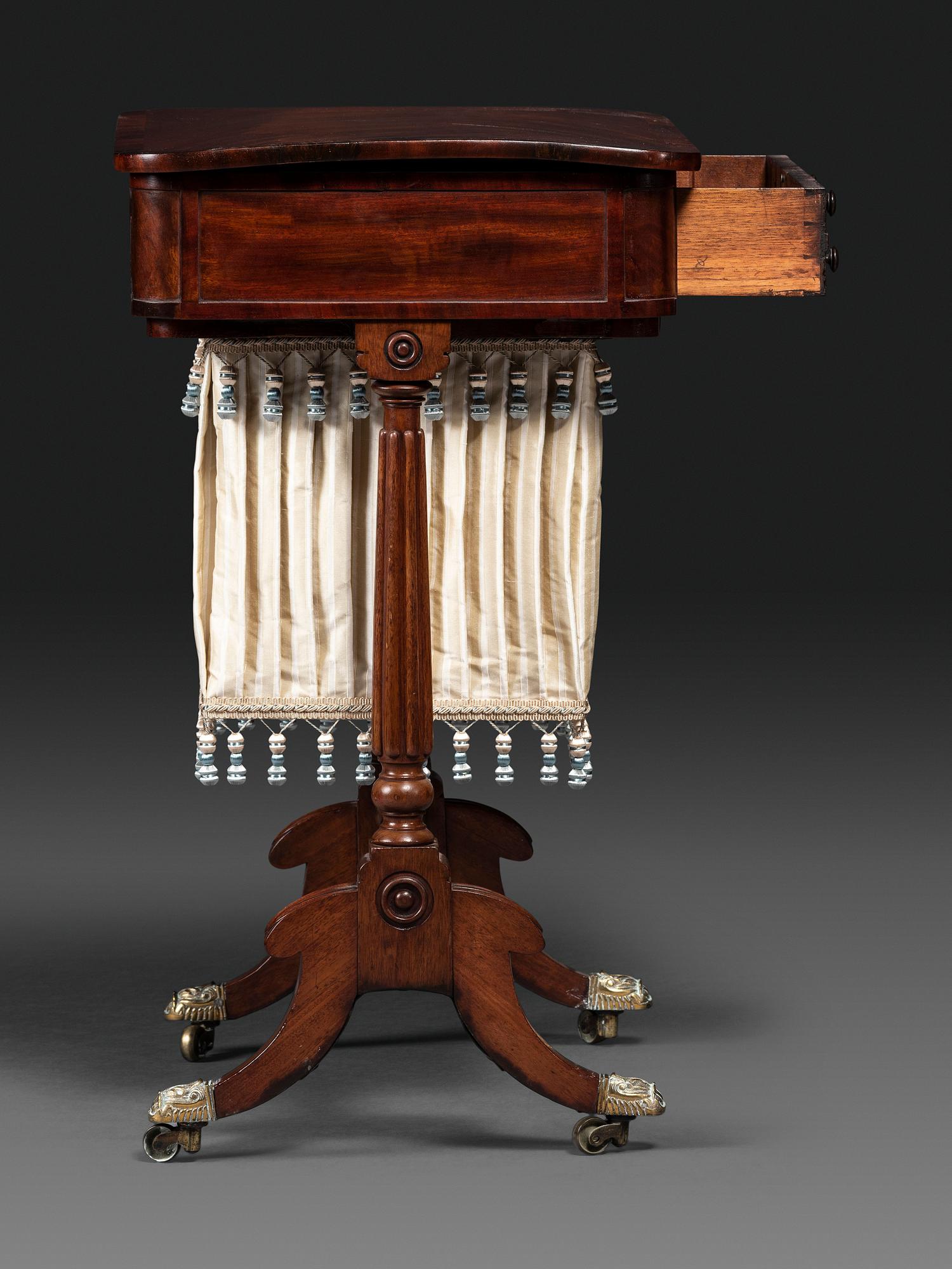 A Classical Figured Mahogany and Rosewood Veneered Sewing Table