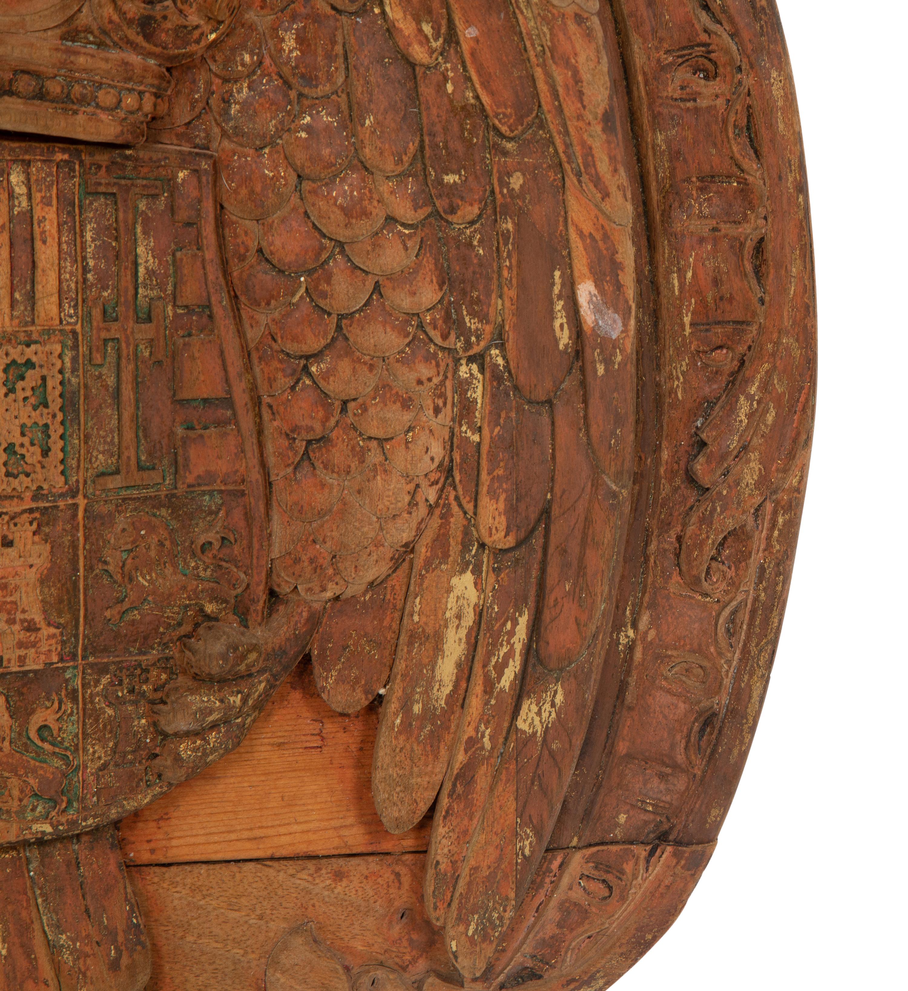 A Continental Carved, Parcel Gilt and Polychrome Painted Heraldic Crest