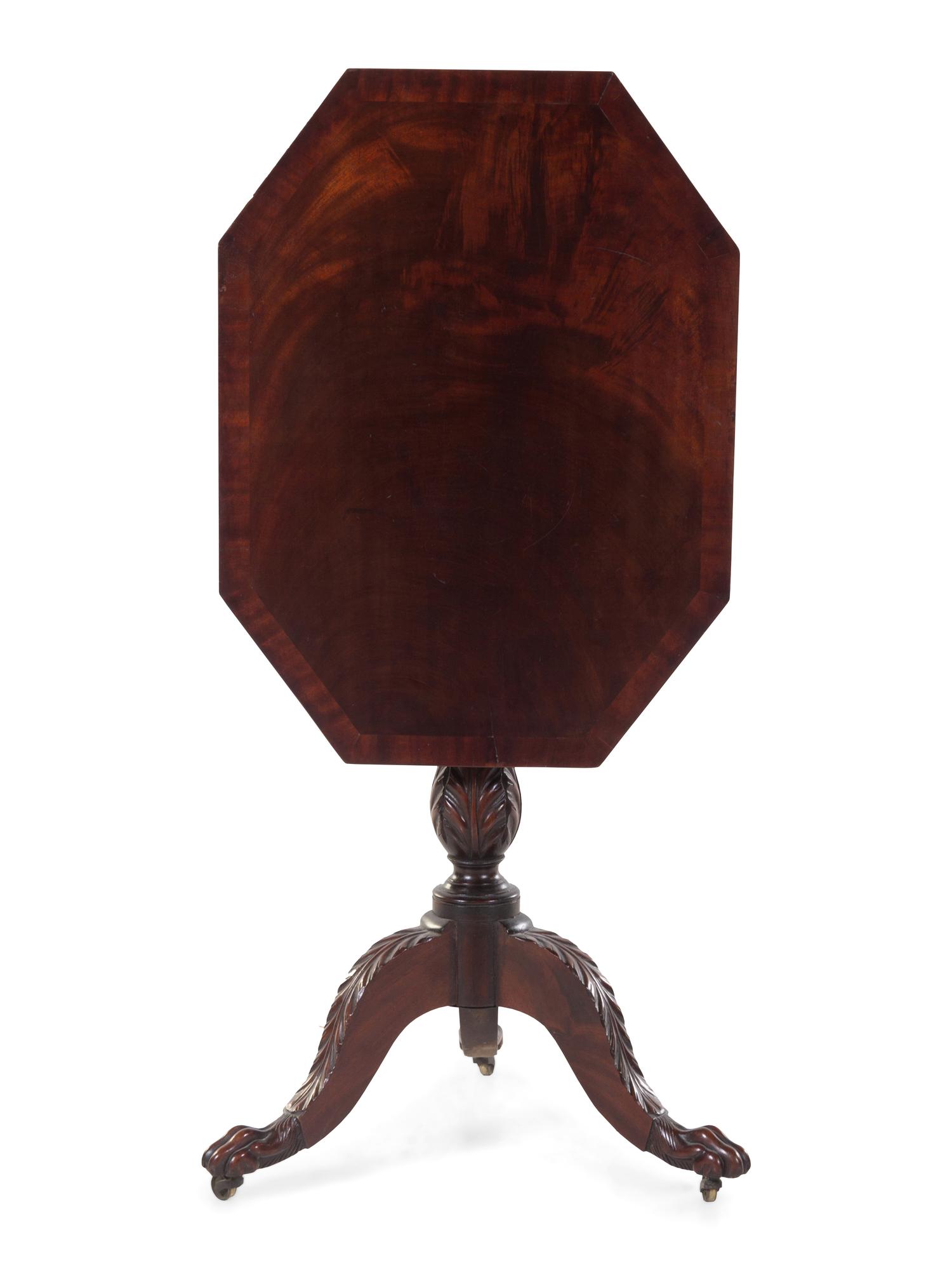 A Classical Carved and Figured Mahogany Octagonal Tilt-Top Candlestand