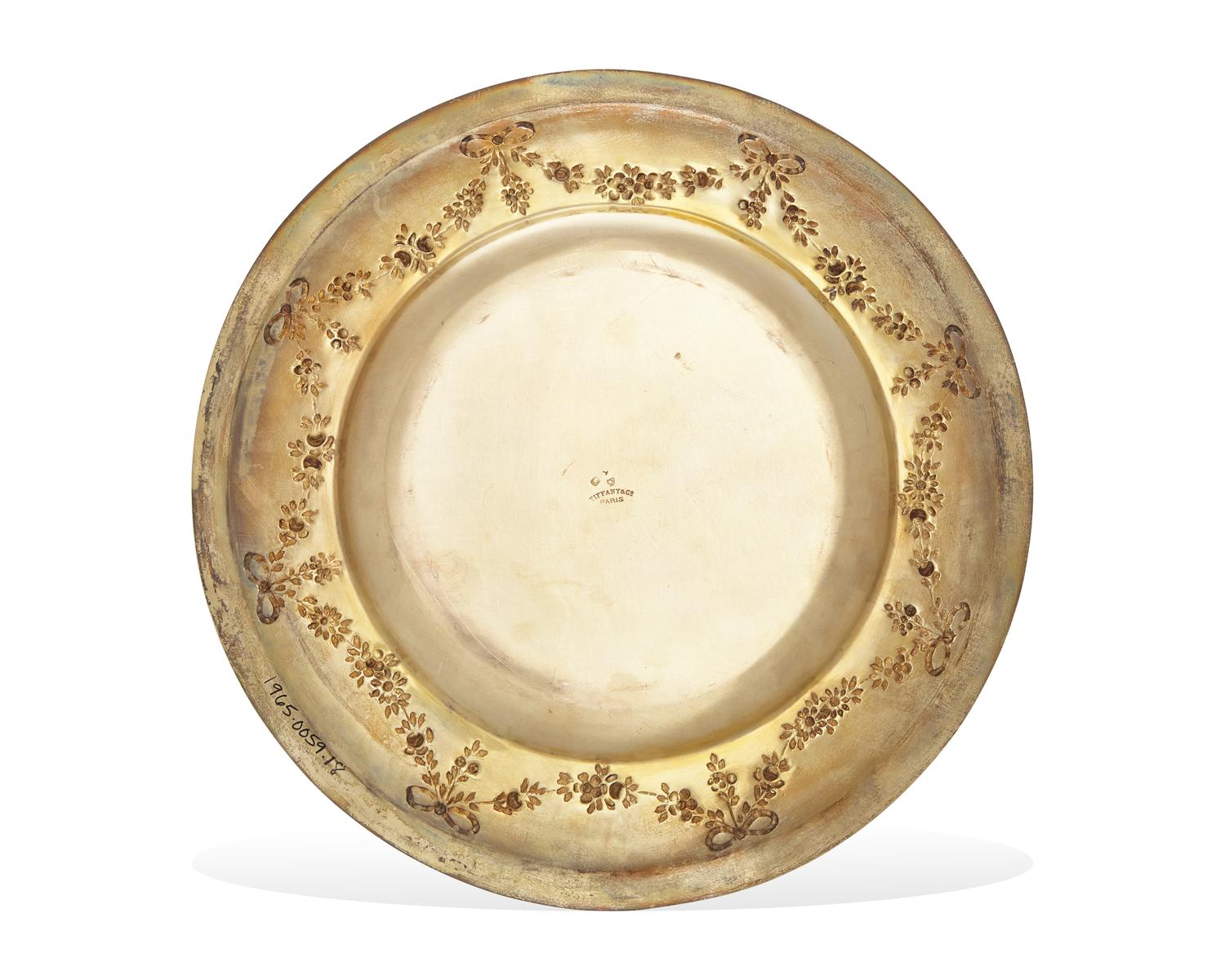 A Set Of Twenty-Nine French Louis XVI Style Silver-Gilt Repousse Dinner Plates