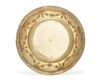 A Set Of Twenty-Nine French Louis XVI Style Silver-Gilt Repousse Dinner Plates