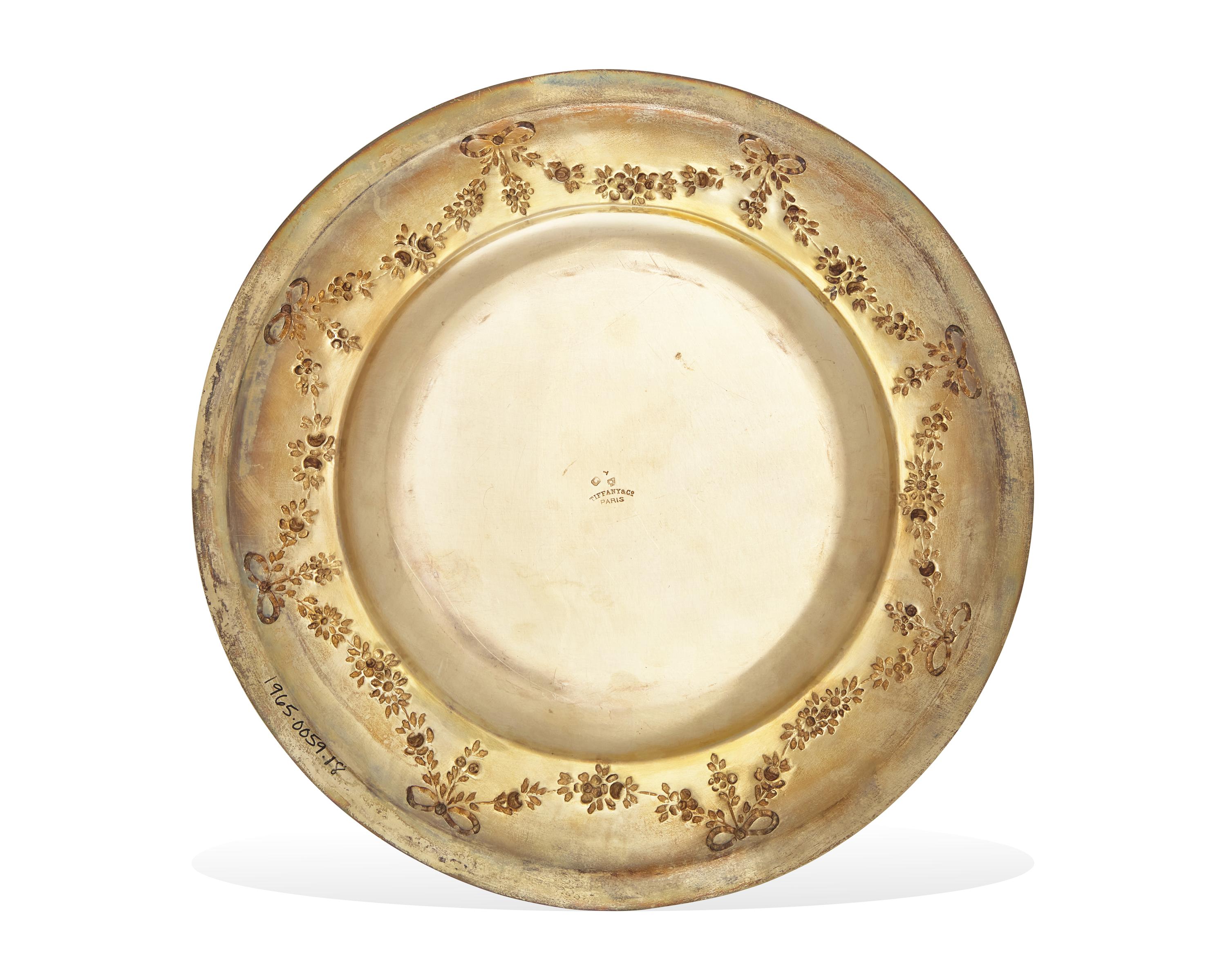 A Set Of Twenty-Nine French Louis XVI Style Silver-Gilt Repousse Dinner Plates