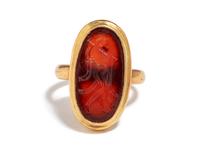 A Roman Carnelian Ring Stone with the Queen Omphale Dressed as Hercules — Set in a gold ring