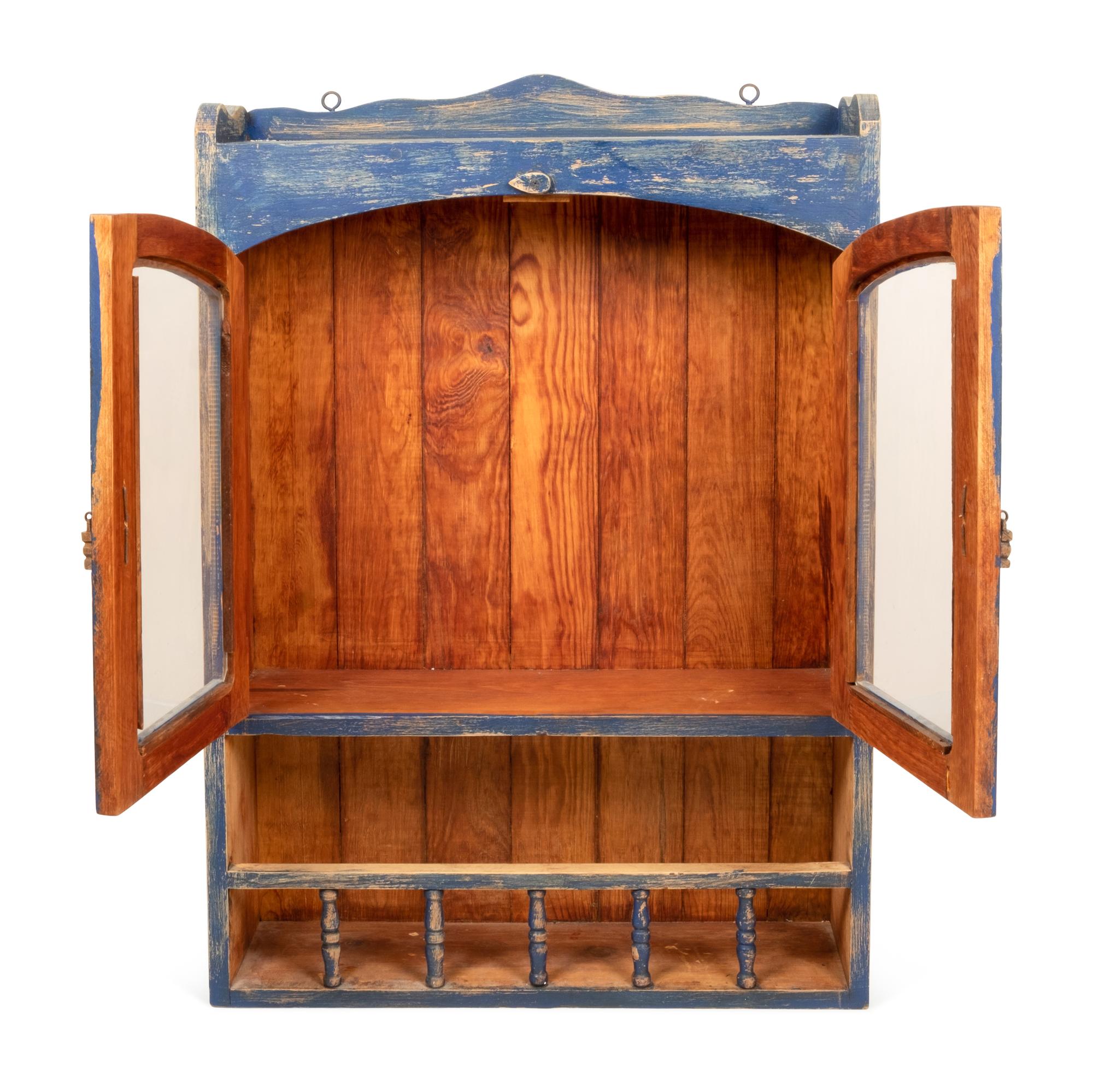 A Rustic Hanging Cabinet in Old Blue Paint