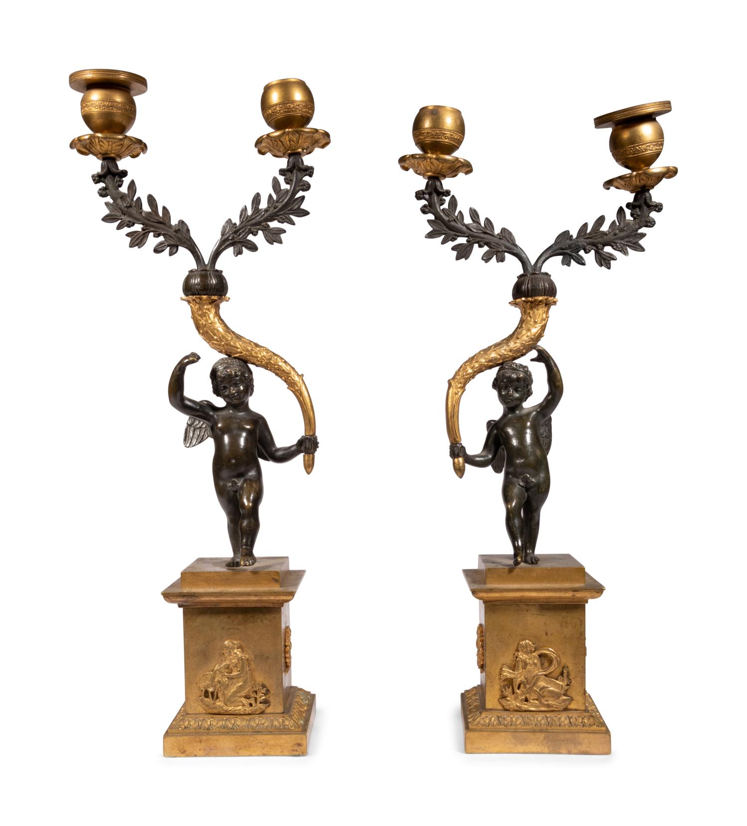 A Pair of Gilt and Patinated Bronze Figural Two-Light Candelabra
