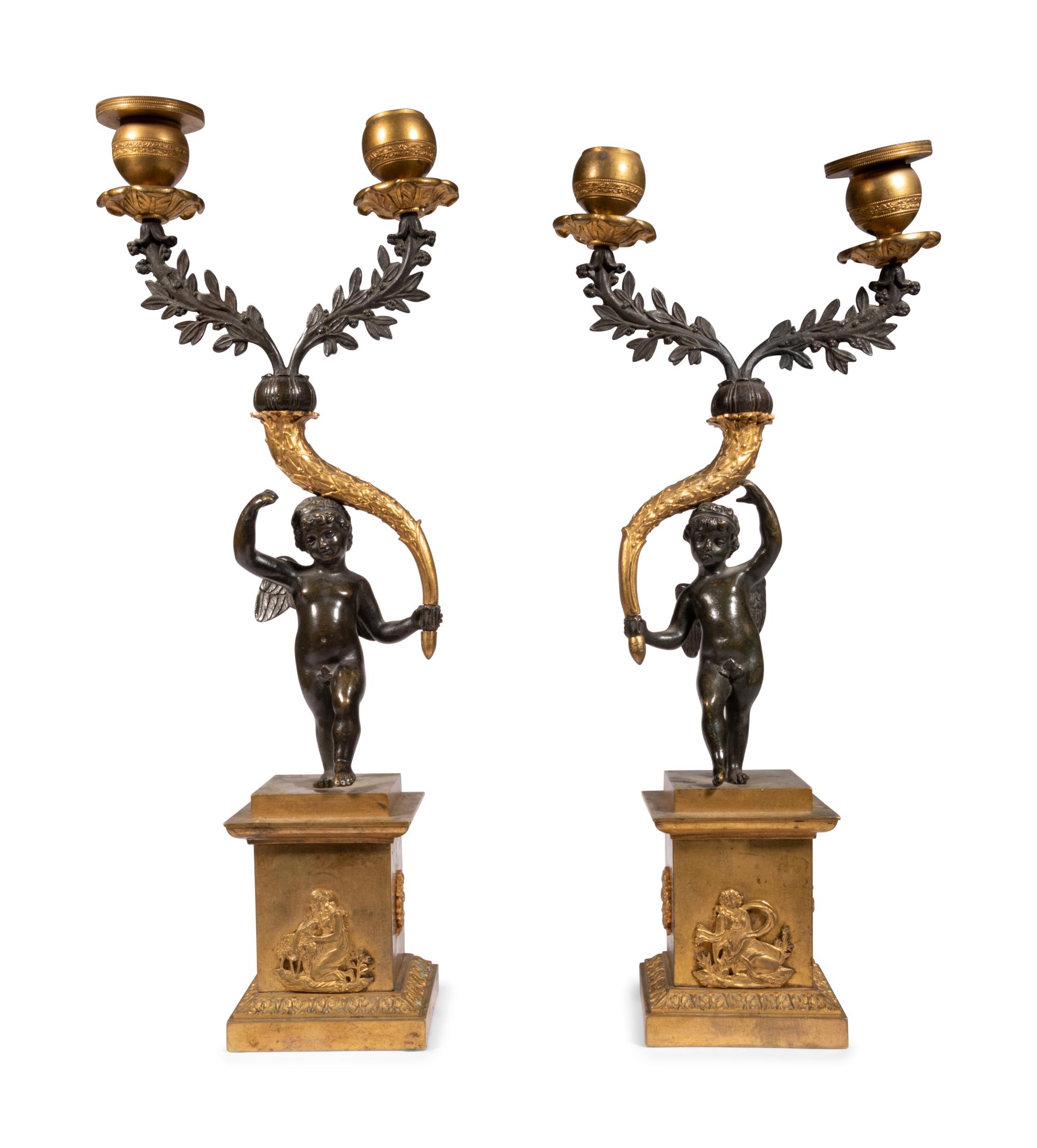 A Pair of Gilt and Patinated Bronze Figural Two-Light Candelabra