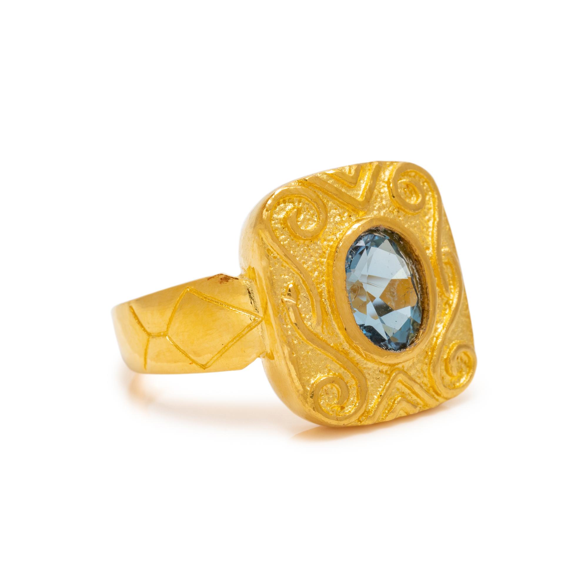HIGH KARAT GOLD AND BLUE TOPAZ RING