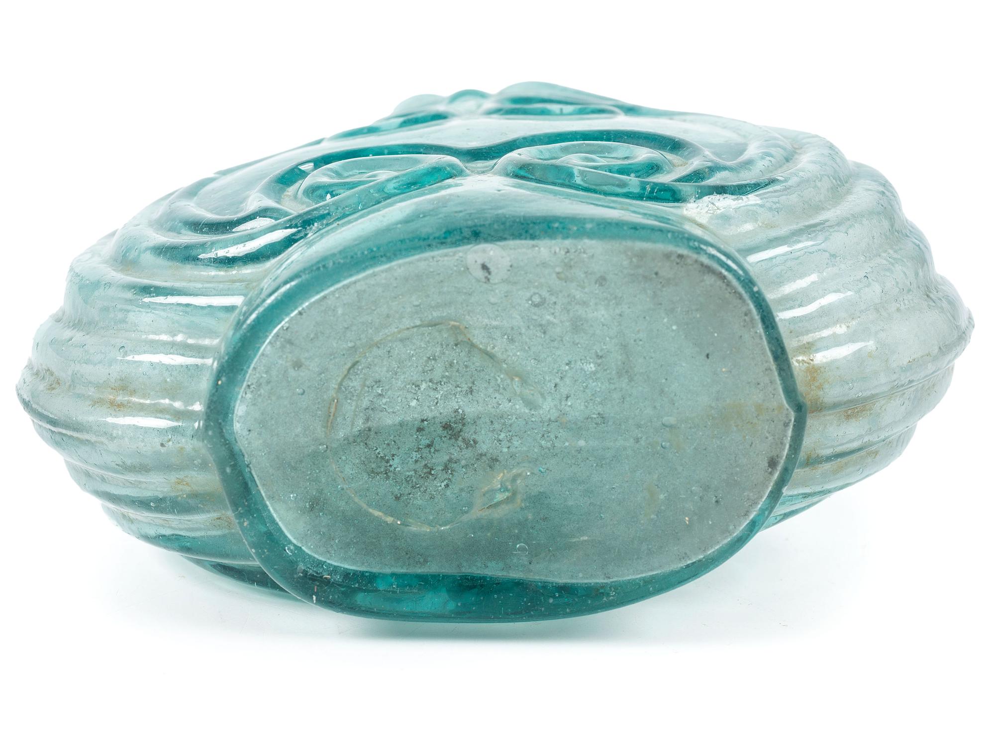 An Early Blown Glass Scroll Flask in Aquamarine