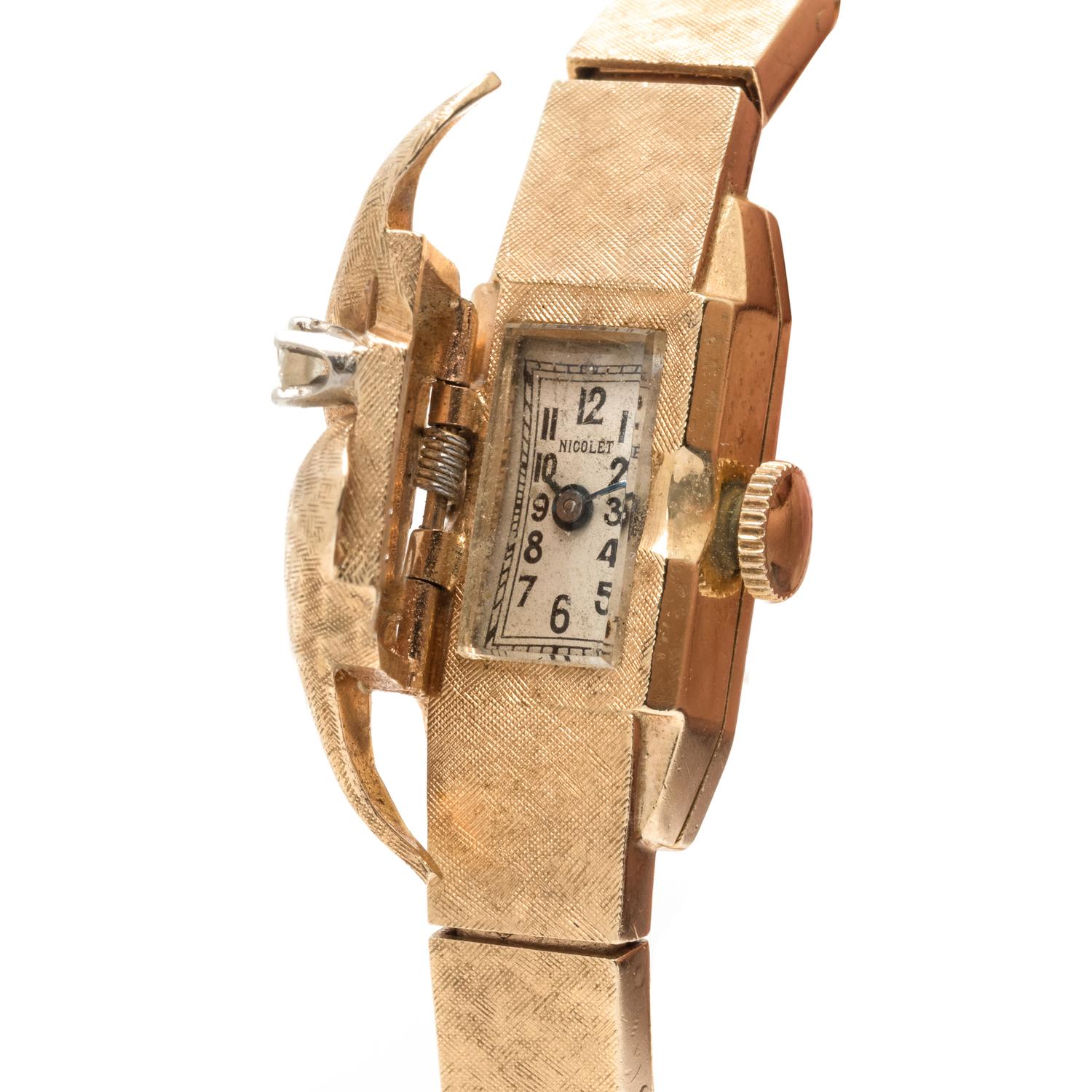 SOLD: 14K YELLOW GOLD AND DIAMOND SURPRISE WRISTWATCH