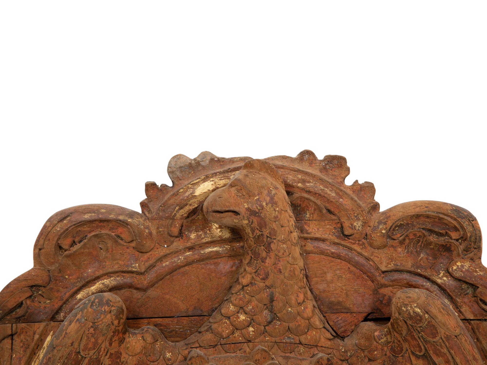 A Continental Carved, Parcel Gilt and Polychrome Painted Heraldic Crest