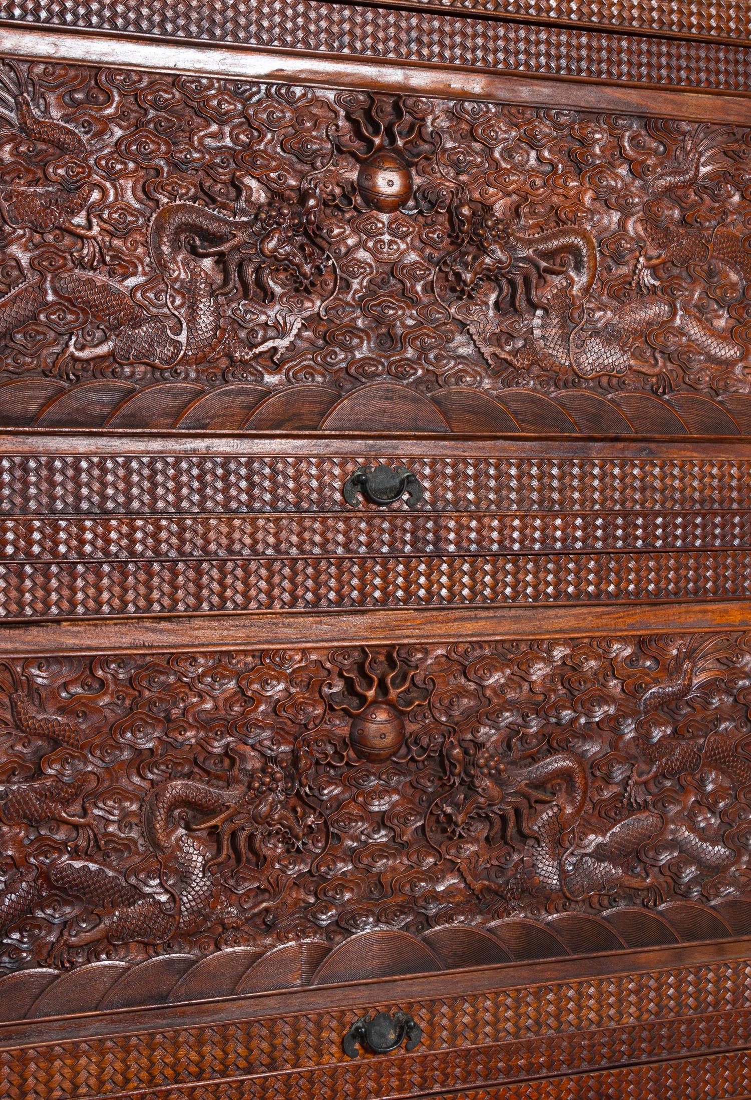 A Carved Huanghuali 'Dragon' Cabinet