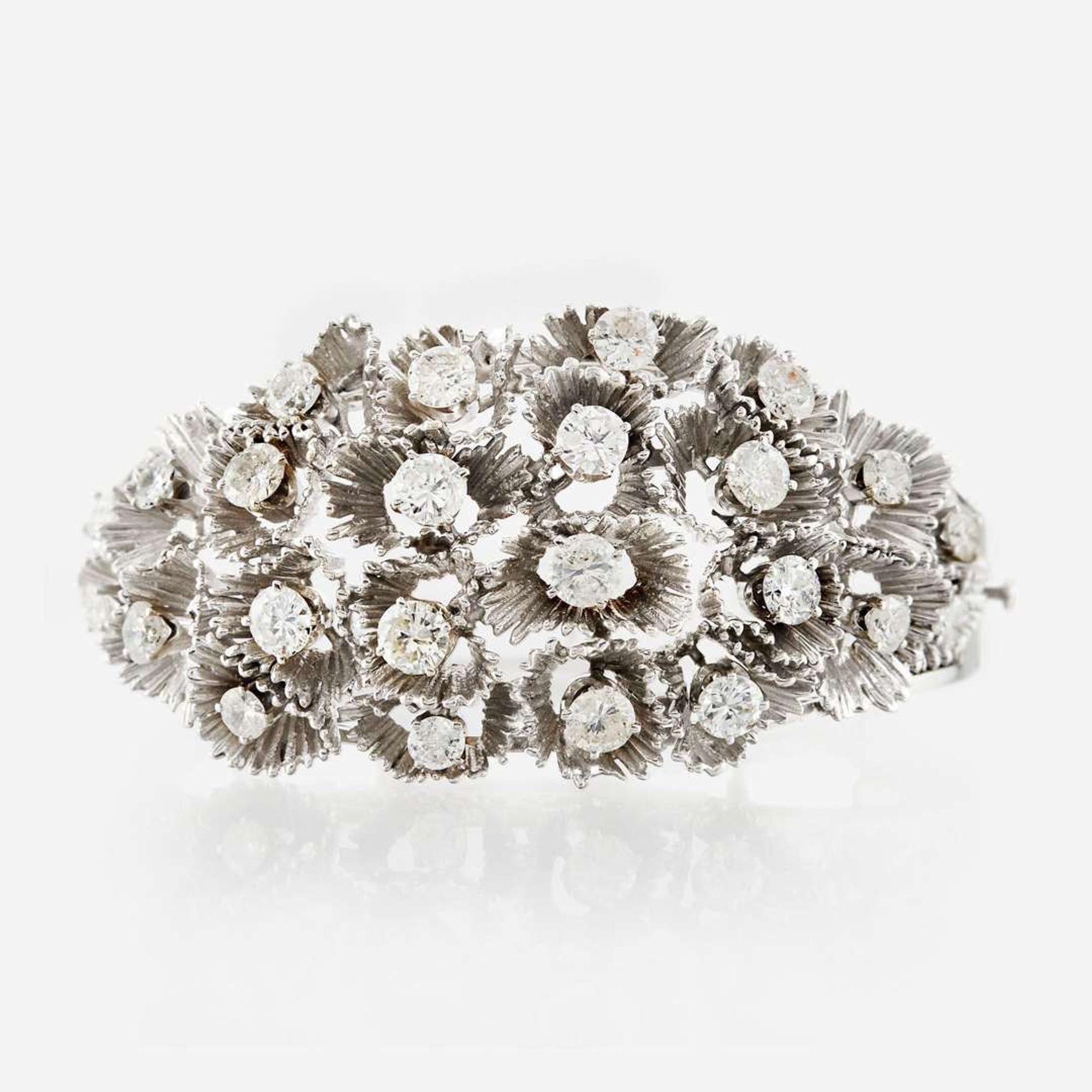 A white gold and diamond bangle