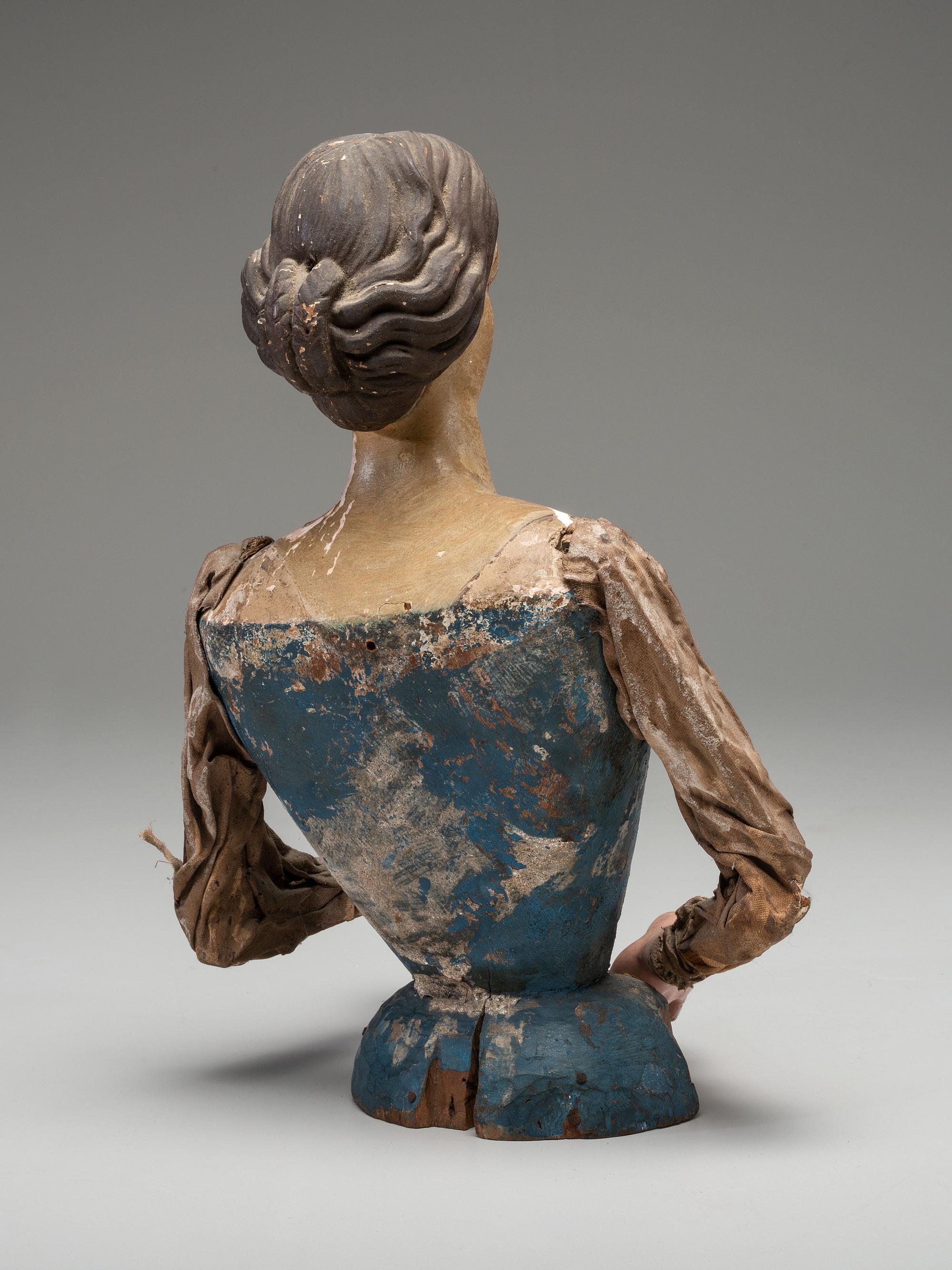 A Carved and Painted Wood Cage Skirt Doll Torso