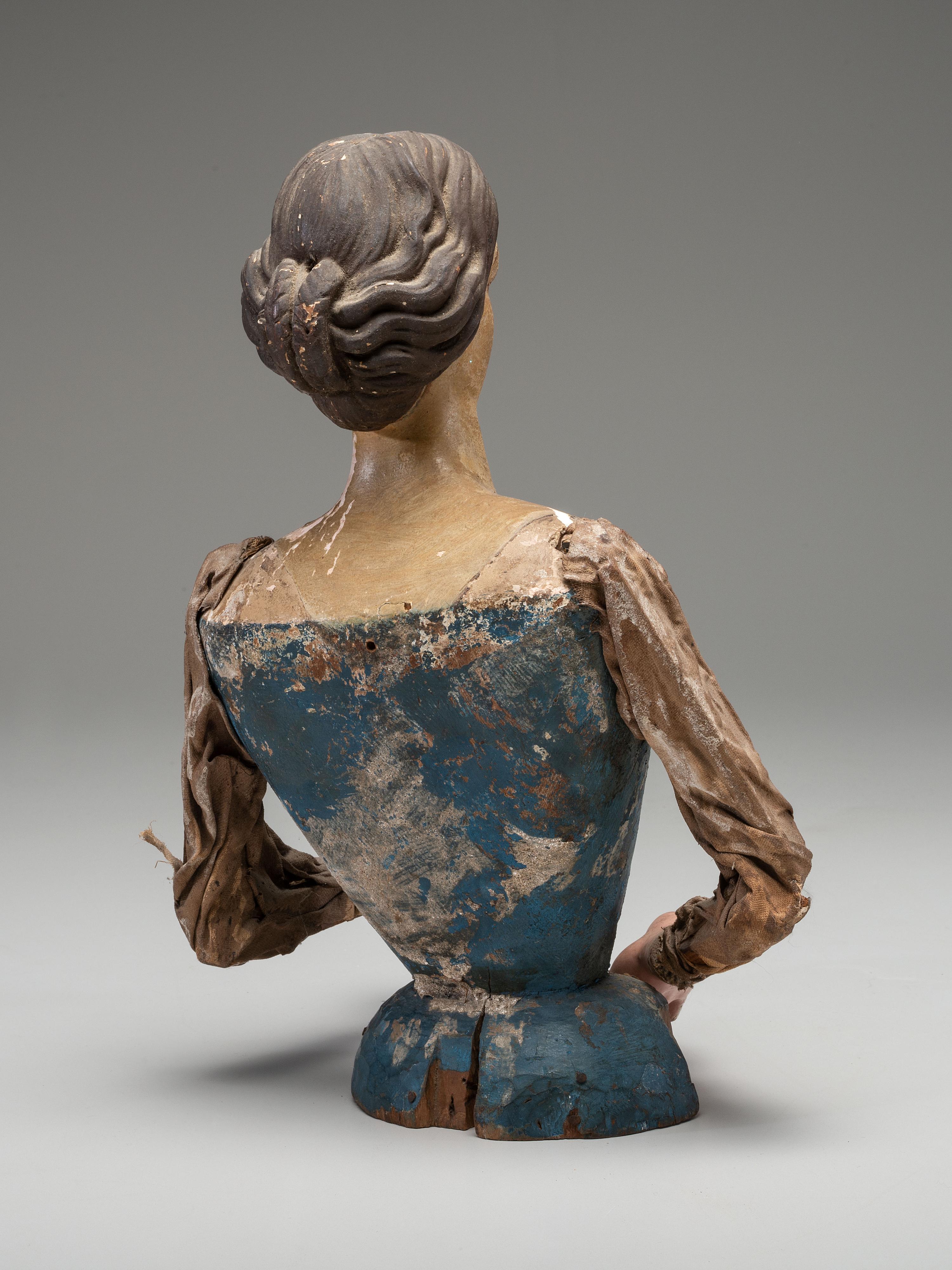 A Carved and Painted Wood Cage Skirt Doll Torso
