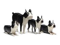 A Set of Four Carved and Painted Wood Boston Terrier Figures