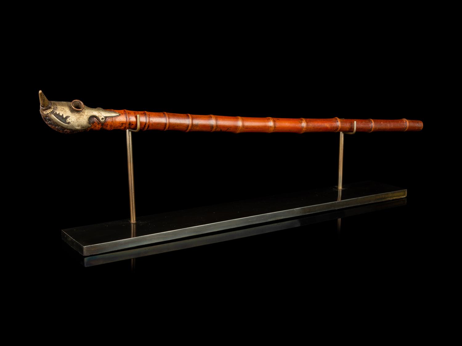 Four Chinese Covered Boxes and A Silvered Metal Mounted Bamboo Opium Pipe