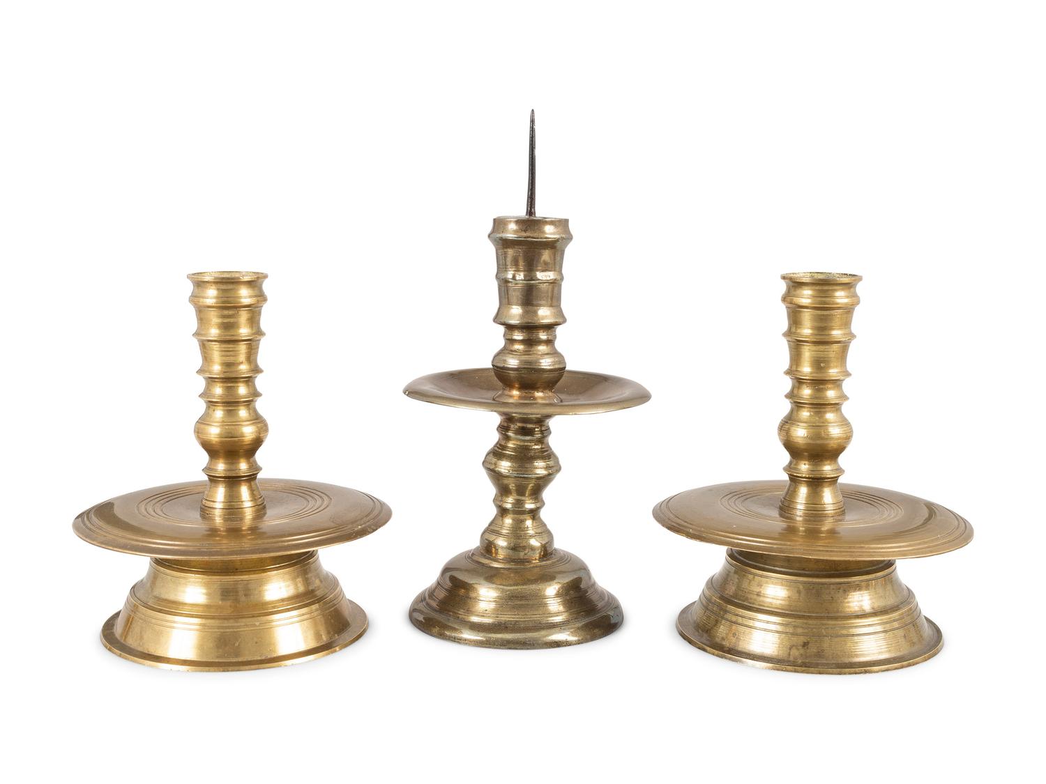 Three Continental Cast Brass Heemskirk Candlesticks