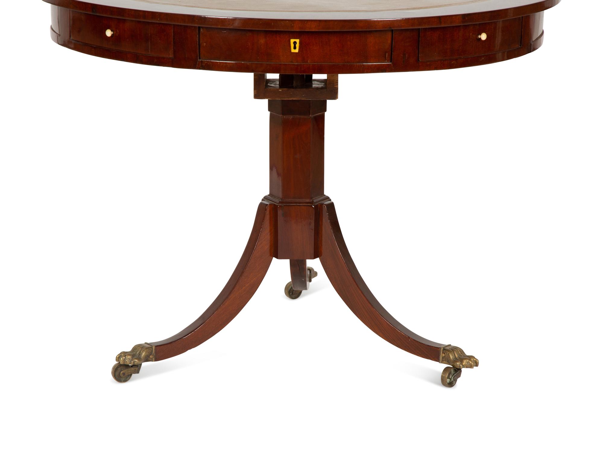A Regency Style Mahogany Center Table with Inset Brown Leather Top — 20th Century