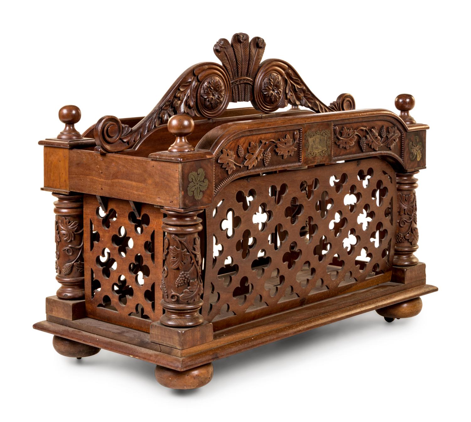 An Oversized Carved Walnut Canterbury