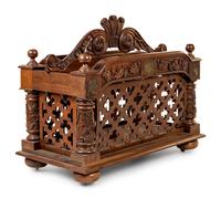 An Oversized Carved Walnut Canterbury