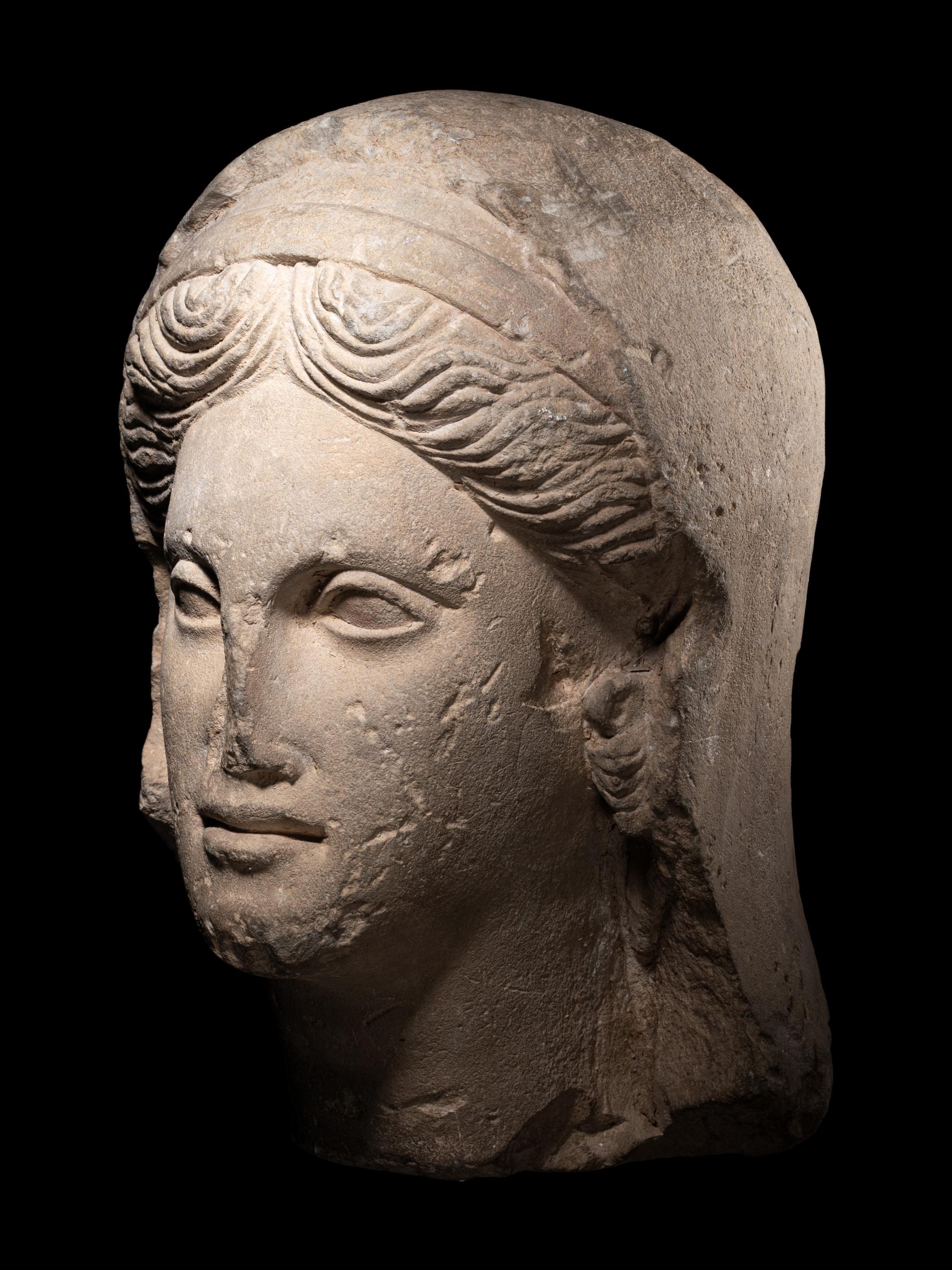 A Greek Limestone Head of a Woman