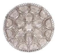 A Large Portuguese Silver Charger, Ourivesaria da Guia, Lisbon, Late 19th/Early 20th Century, having allover repousse decoration worked